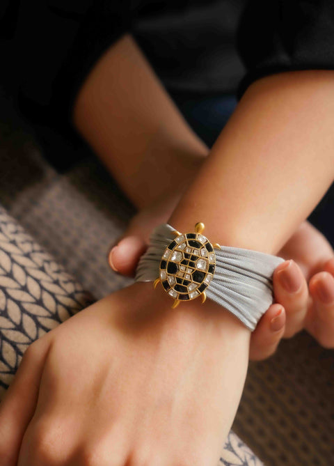 SILVER MESH CUFF WITH BROOCH